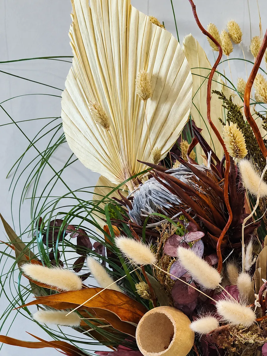 Close up of the bleached palm spear and dried grasses