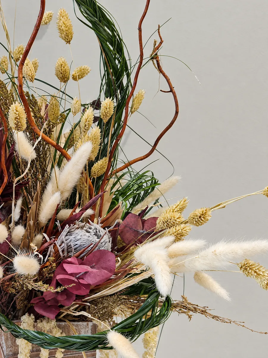 Close up of dried protea, bunny tails and curly willow