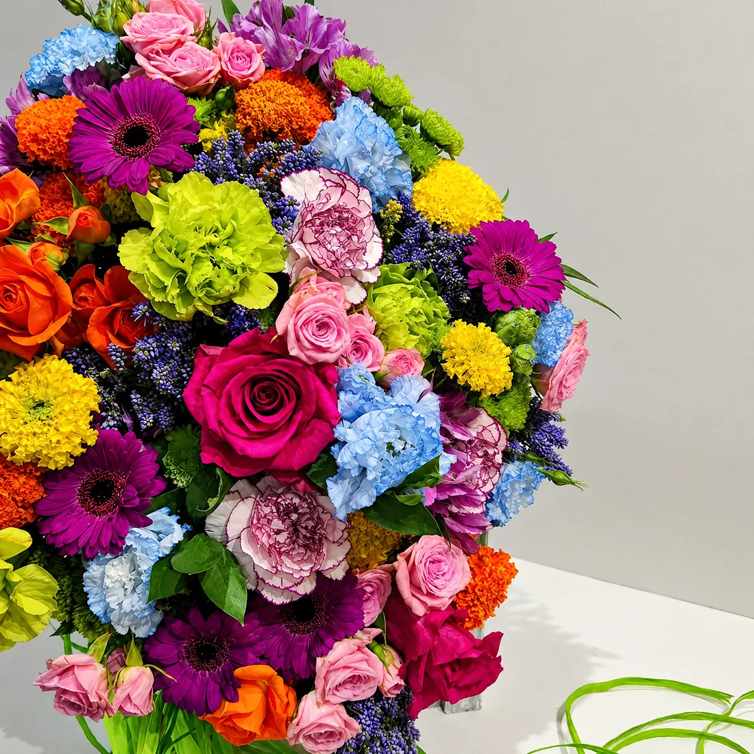 A large bouquet of roses, gerberas, hydrangea and carnations in every colour